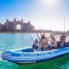 Xclusive Yachts Speed boat cruising through Dubai Marina with stunning views of the skyline, available to book through El Camino Travel.