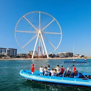 Xclusive Yachts Speed boat cruising through Dubai Marina with stunning views of the skyline, available to book through El Camino Travel.